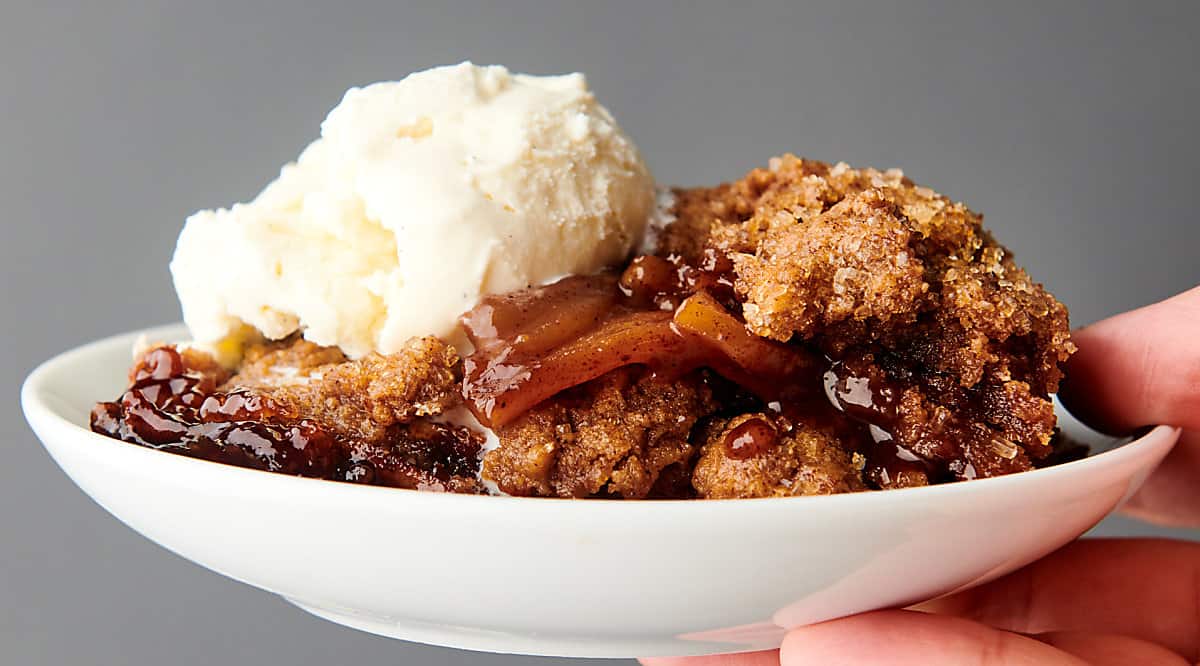 plate of apple cobbler with ice cream