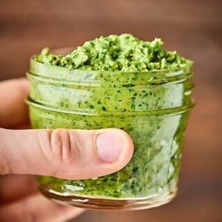 This Avocado Pesto Recipe is vegan, gluten free, oil free, and oh yeah, absolutely delicious! Packed with fresh herbs, garlic, pistachios, nutritional yeast, and more! showmetheyummy.com
