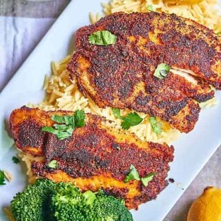 This blackened tilapia recipe is not for the weak! It's spicy, the flavors are bold, and the lemon juice brightens the whole thing up! For those of you who think healthy eating is boring, think again! showmetheyummy.com #fish #tilapia #spicy #spicerub #healthy #lemon