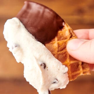 chocolate chip cannoli dip on a waffle cone chip