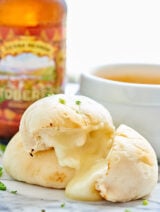 These Cheese Bombs with Beer Cheese Dip are a great, easy game day snack! Pillsbury biscuits are stuffed with cheese and paired with a beer cheese sauce! showmetheyummy.com #beer #cheese