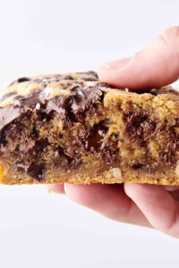 holding an easy chocolate chip cookie bar in hand