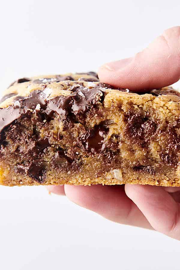 holding a cookie bar with chocolate chips