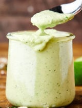 spoon in jar of cilantro lime sauce