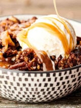 Easy Slow Cooker Carrot Cake Recipe. A layer of instant pudding is topped with pecans, coconut, and carrots, drizzled in caramel sauce, sprinkled with spice cake mix, and then topped with a butter, brown sugar, pecan streusel topping. Quick, easy, and SO decadent. The perfect gooey, fluffy crockpot cake! showmetheyummy.com #slowcooker #crockpot #cake #carrotcake #dessert
