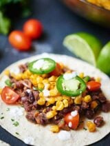 These easy vegan black bean and roasted corn tacos are so good you’ll want them for Meatless Monday and Taco Tuesday! Healthy, filling, and so delicious! showmetheyummy.com #meatlessmonday #vegan #tacotuesday #vegetarian #taco #healthy #glutenfree