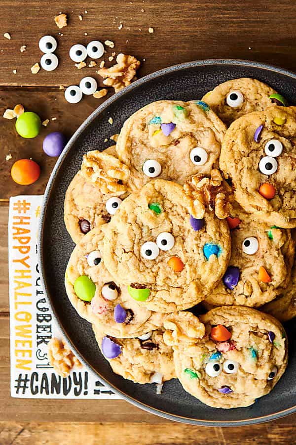 halloween monster eye walnut cookies on plate above
