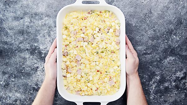 unbaked ham and cheese breakfast casserole in baking dish