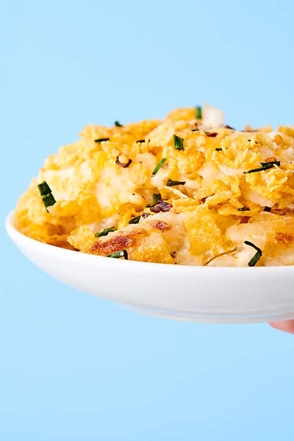 plate of hashbrown casserole blue background