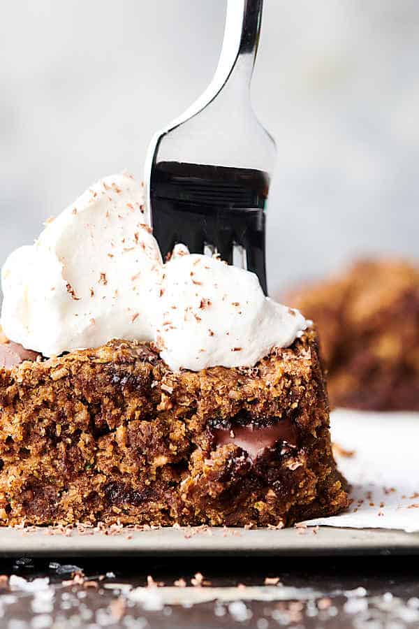 healthy zucchini oat bars topped with whipped cream
