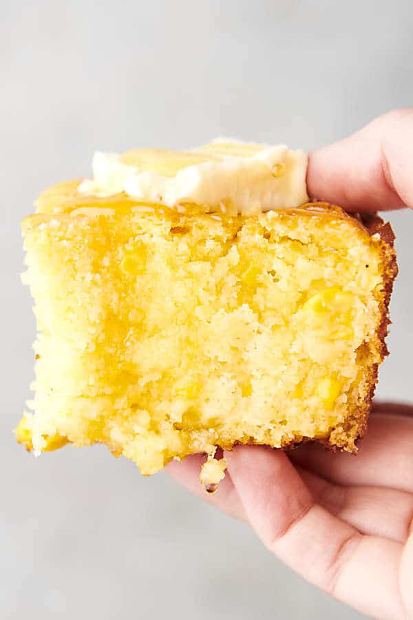 piece of Jiffy cornbread topped with butter and honey