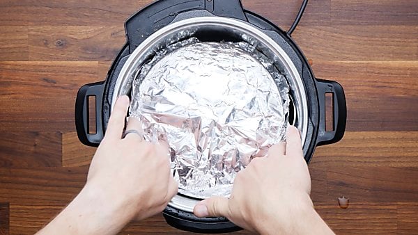 cake pan in instant pot covered with foil