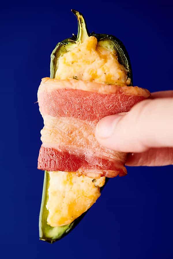 holding jalapeno poppers