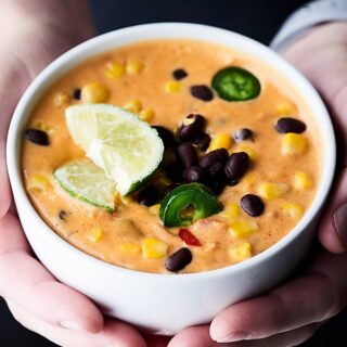 #ad This Loaded Queso Recipe is full of cheese, tomatoes, black beans, corn, chiles, taco seasonings, and more! Easy. Cheesy. Gluten Free. Delicious! showmetheyummy.com Made in partnership w/ @redgoldtomatoes #queso #cheesedip
