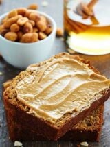This Peanut Butter Honey Banana Bread recipe is moist, peanut butter-y, naturally sweetened w/ honey & bananas, & topped w/ a honey roasted peanut streusel. showmetheyummy.com #bananabread #baking