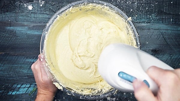 sugar cookie dough being mixed in bowl