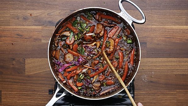 sauce with veggies in saute pan