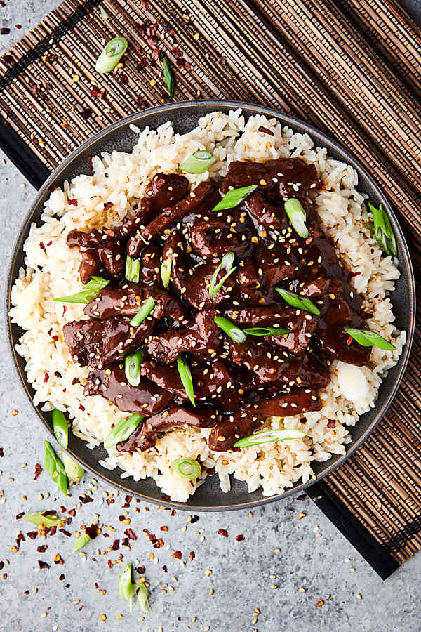 plate of slow cooker mongolian beef on plate above